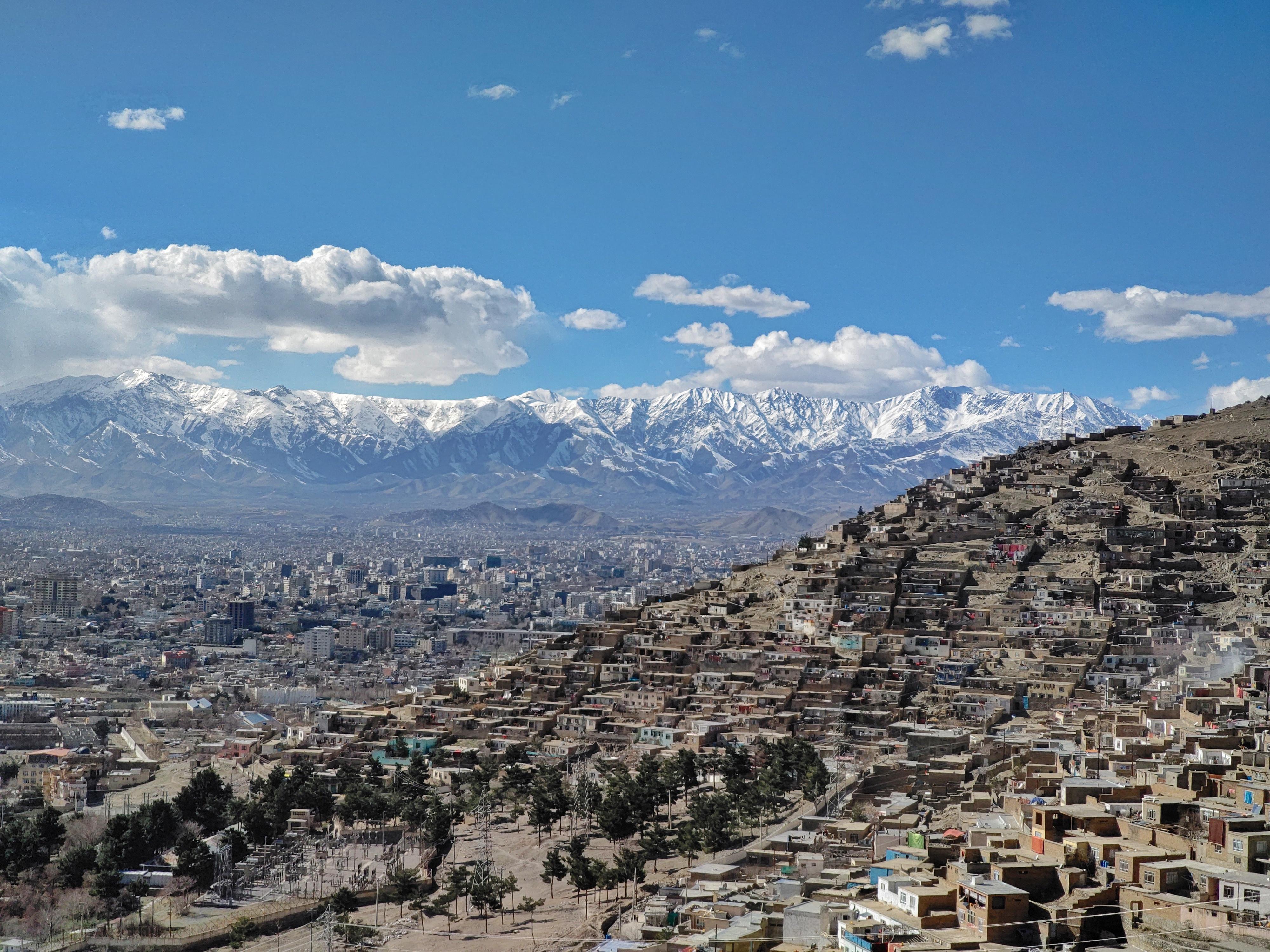 View of the Kabul City Panorama With Hillside Neighborhoods and Snow-Covered Mountain Range - Afghanistan eSim
