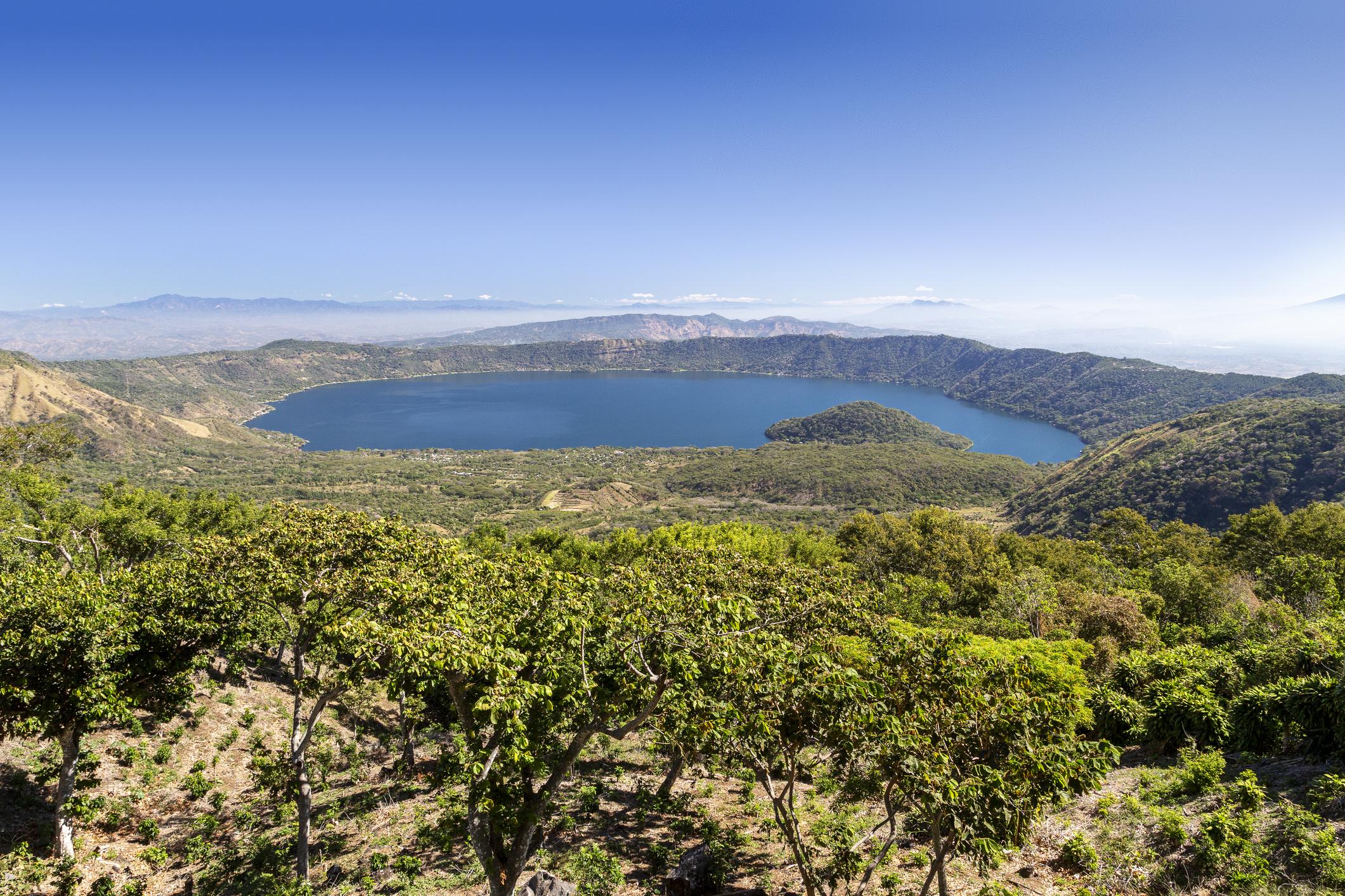 View of the Lake Coatepeque Volcanic Crater Lake Surrounded by Forested Hills, near Santa Ana - El Salvador eSim