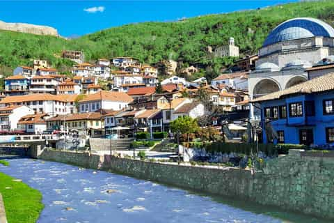 Historic riverside old town of Prizren with hillside houses - Kosovo eSIM