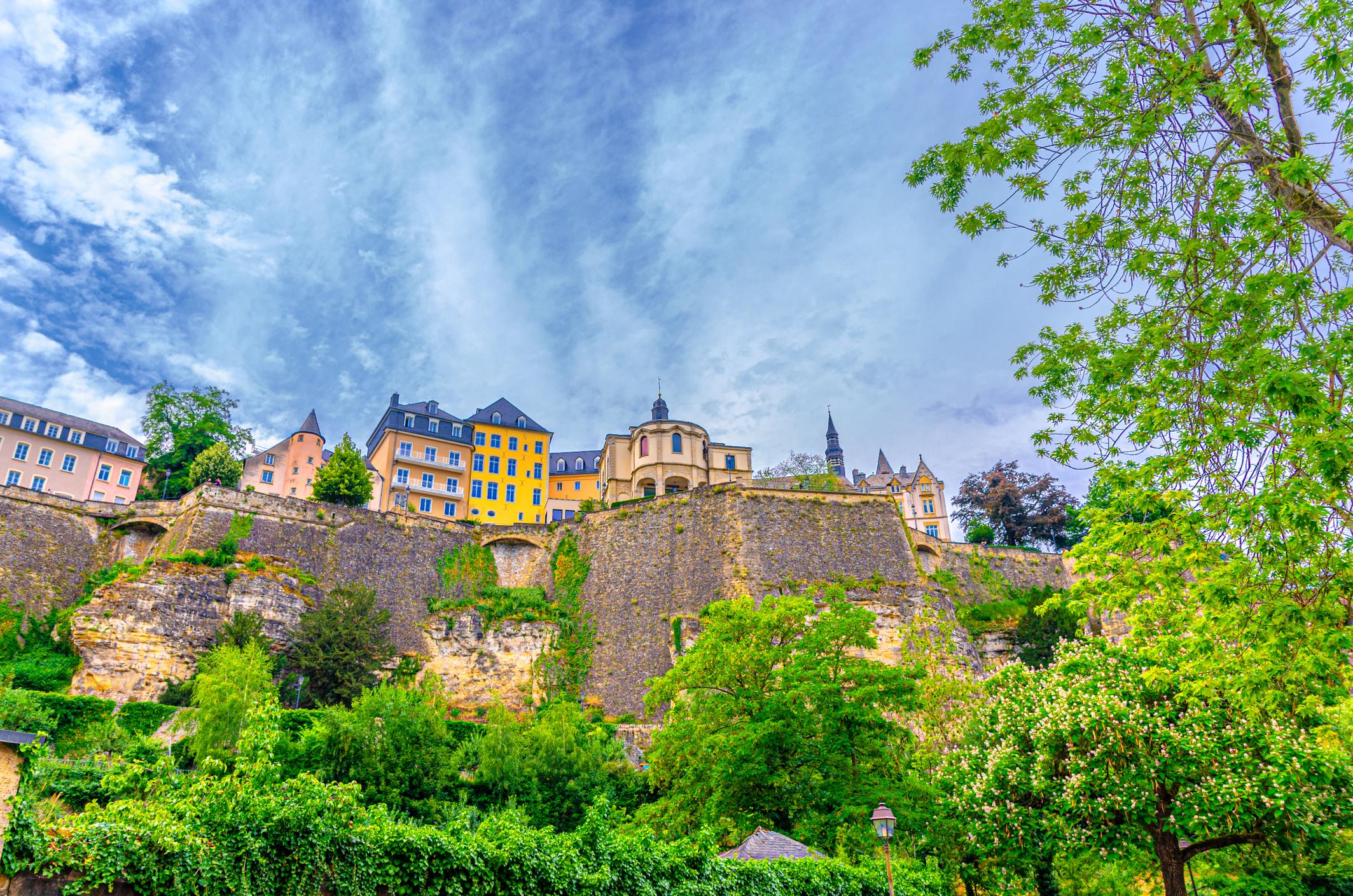 View of Old buildings and Bock Promontory Casemates fortification wall rock cliffs tower of The Fortress - Luxembourg eSim
