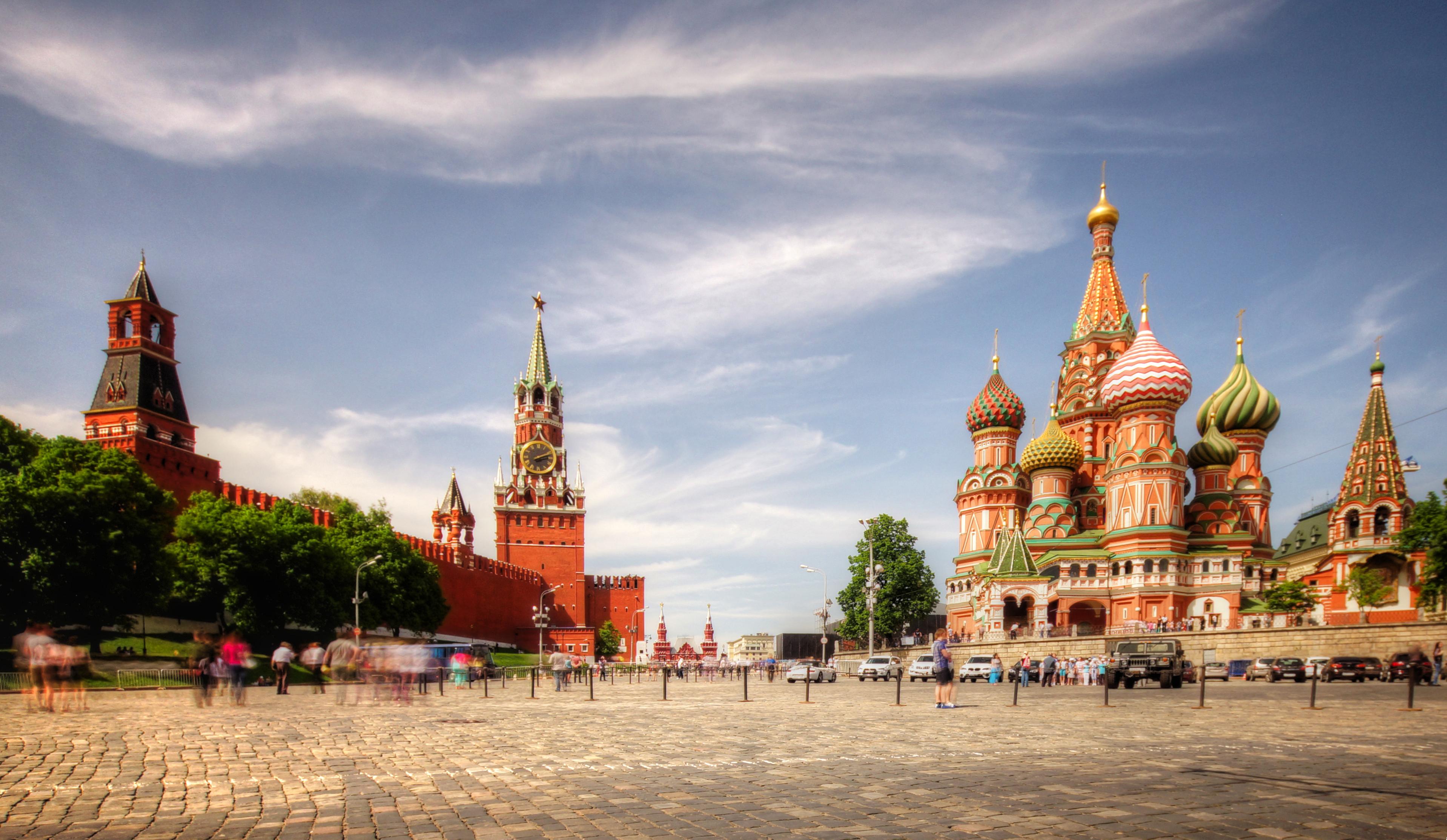 View of the Intercession Cathedral or St. Basil's Cathedral and the Spassky Tower of Moscow Kremlin at Red Square in Moscow - Russia eSim